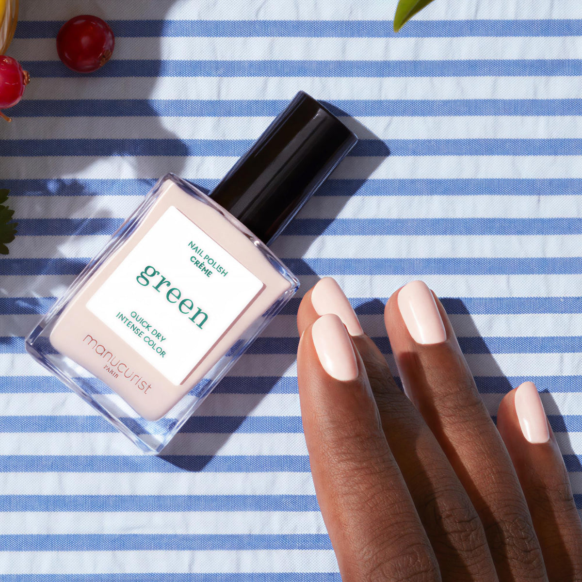 Manucurist bottle close-up label emphasizing vegan plant-based formulation benefit