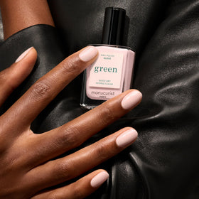 Manucurist swatch on nail wheel showing pearly iridescence and wearable neutral finish