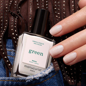 Manucurist Green Nebula swatch on nail stick showing buildable milky coverage