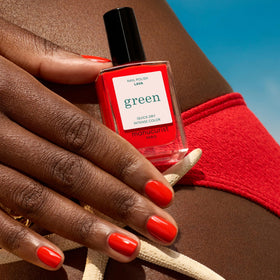Manucurist swatched on fingertips showing opaque coverage benefit