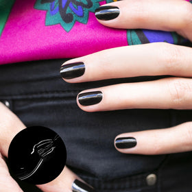 Manucurist Licorice brush applying smooth black stroke for even application benefit