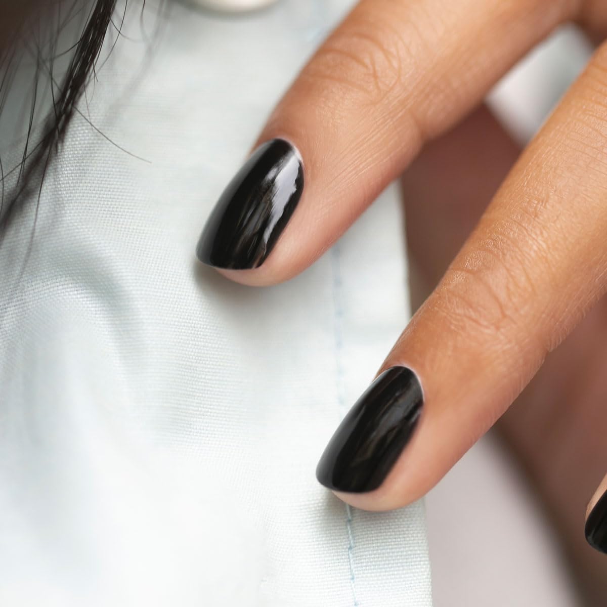 Manucurist Licorice swatch on nail wheel illustrating true opaque coverage benefit