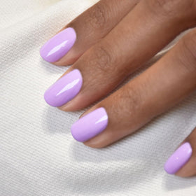 Manucurist swatch on skin highlighting true lilac tone and opaque payoff