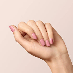 Manucurist swatch on nails showing opaque powder-pink and long-wear benefit