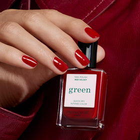 Manucurist swatch on model hand showing opaque Red Velvet coverage benefit of bold color