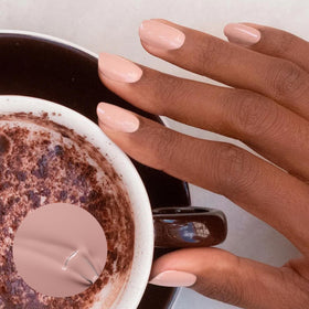 Manucurist brush applying Shell Beige for smooth, streak-free coverage