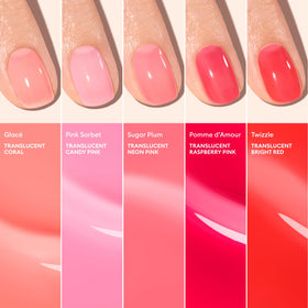 Manucurist manicured hands in lifestyle setting showcasing subtle glossy pink nails