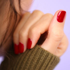 Manucurist swatch of Red Cherry on skin demonstrating opaque coverage