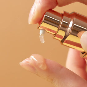 ma:nyo serum texture drop on hand demonstrating lightweight hydrating feel