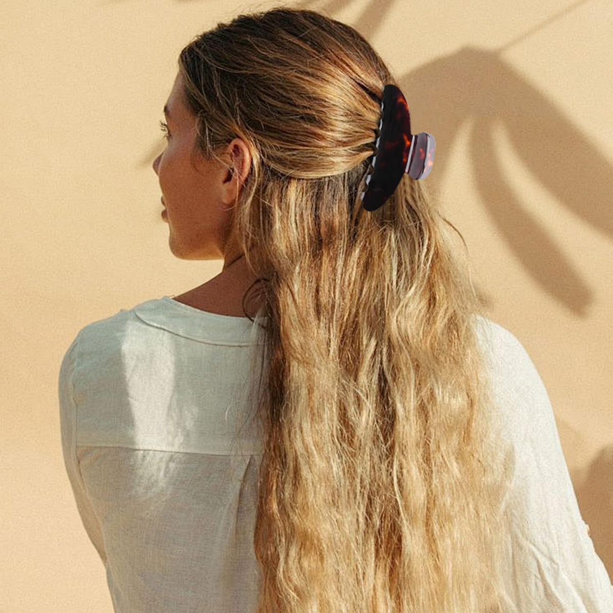MAORULU holding a full bun illustrating strong hold on long hair