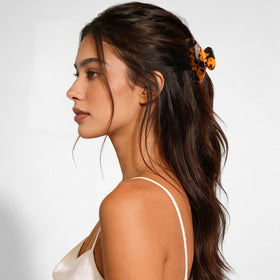 MAORULU styled half-up bun demonstrating secure hold and polished look