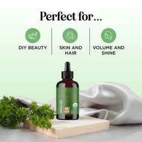 Maple Holistics amla oil pouring to show lightweight texture and shine