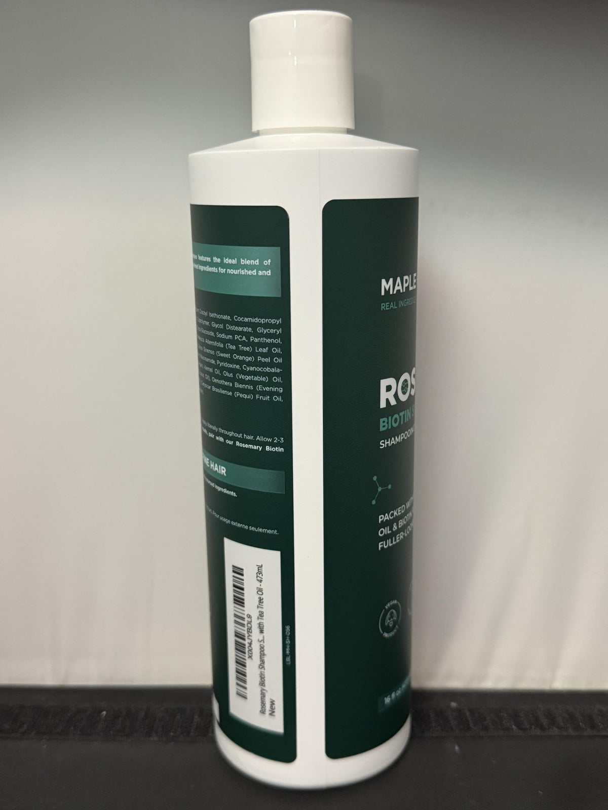 Maple Holistics shampoo on bathroom shelf showing everyday styling use