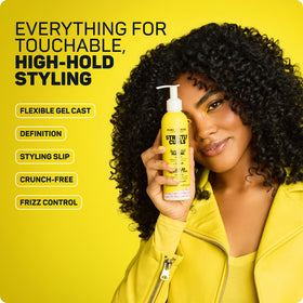 Marc Anthony hands applying gel to wet hair for even distribution and definition