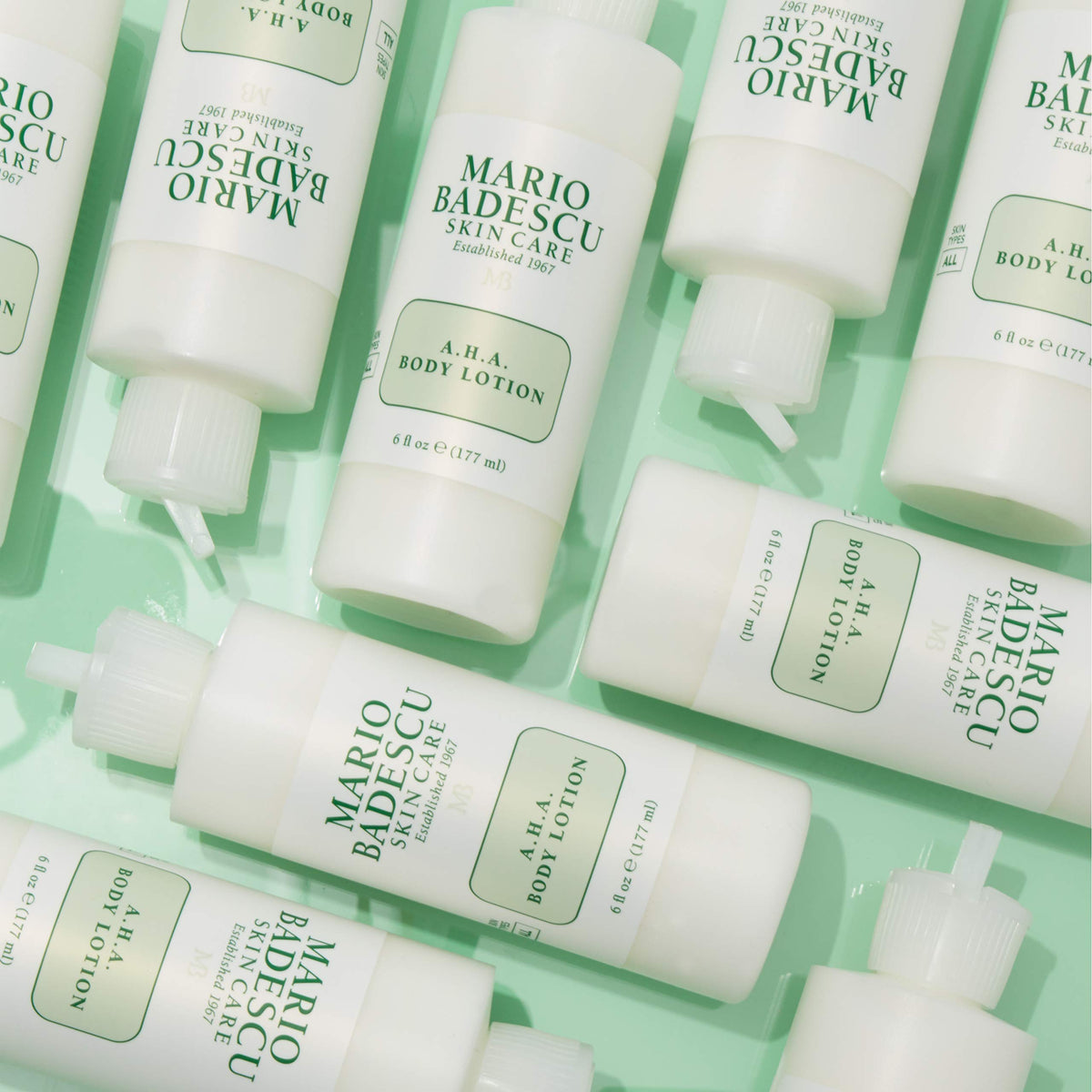Mario Badescu lotion being dispensed onto hand demonstrating easy application