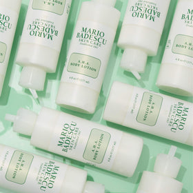 Mario Badescu lotion being dispensed onto hand demonstrating easy application