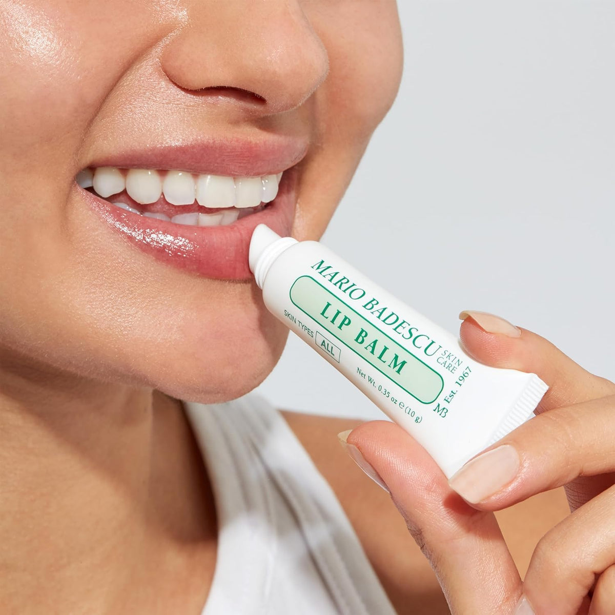 Mario Badescu balm on fingertip demonstrating easy squeeze-tube use