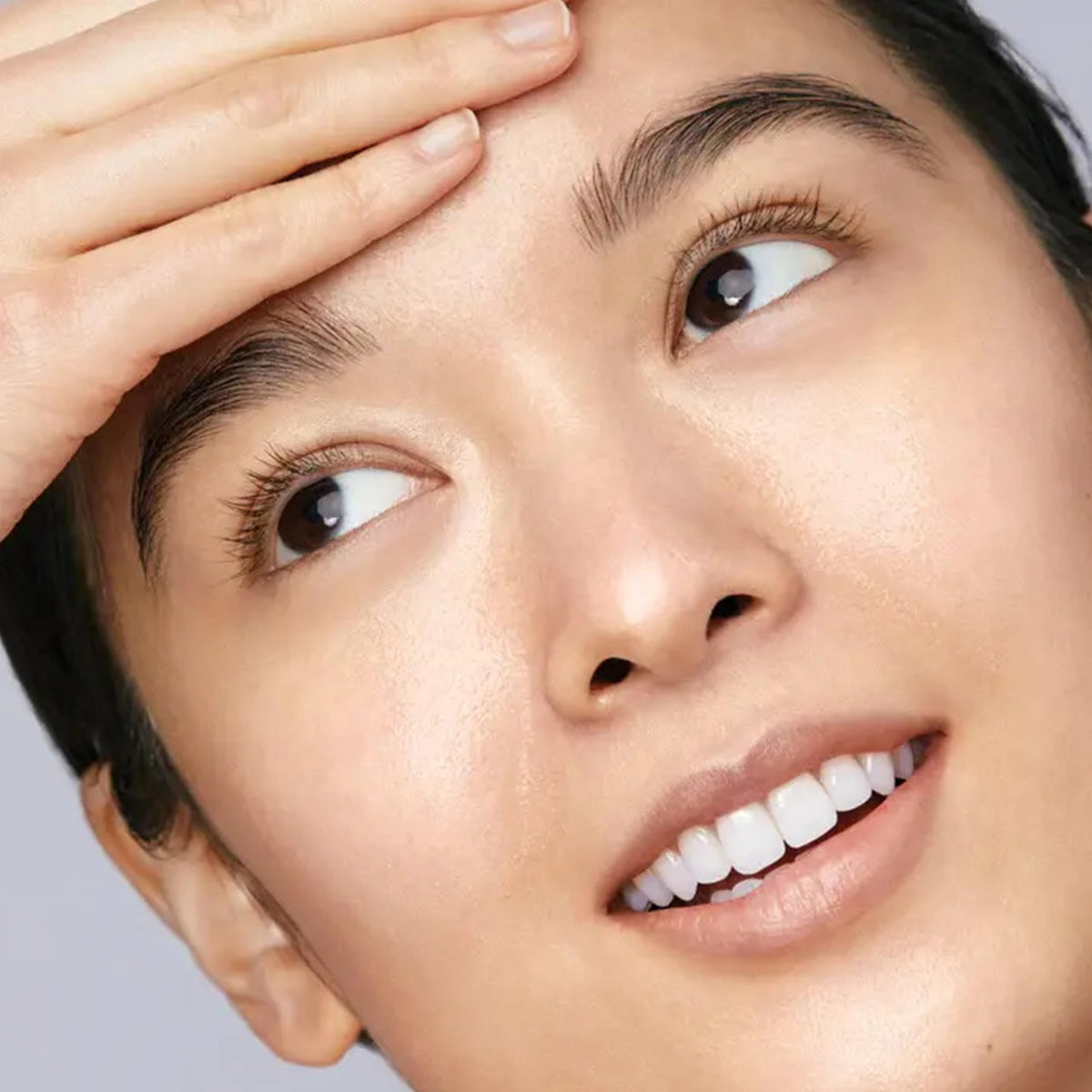 Mario Badescu removing waterproof mascara from closed eye demonstrating gentle efficacy