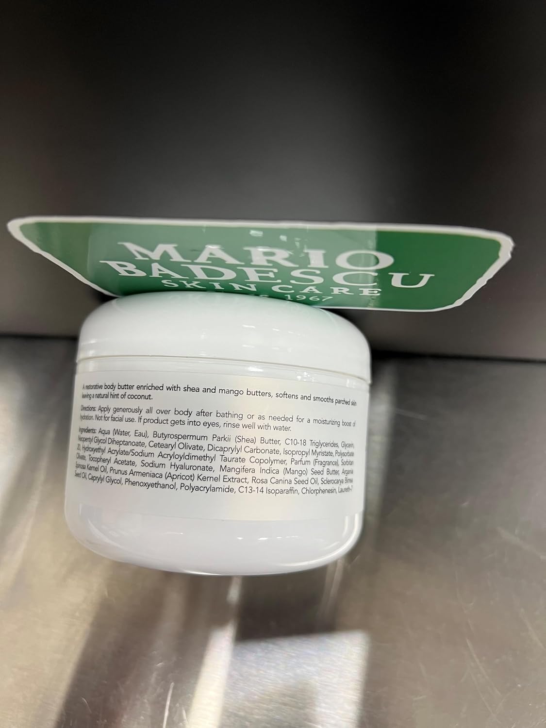 Mario Badescu jar on bathroom shelf in lifestyle scene for daily routine benefit