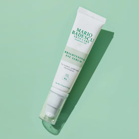 Mario Badescu compact 0.5 oz bottle next to coin for size comparison and portability benefit