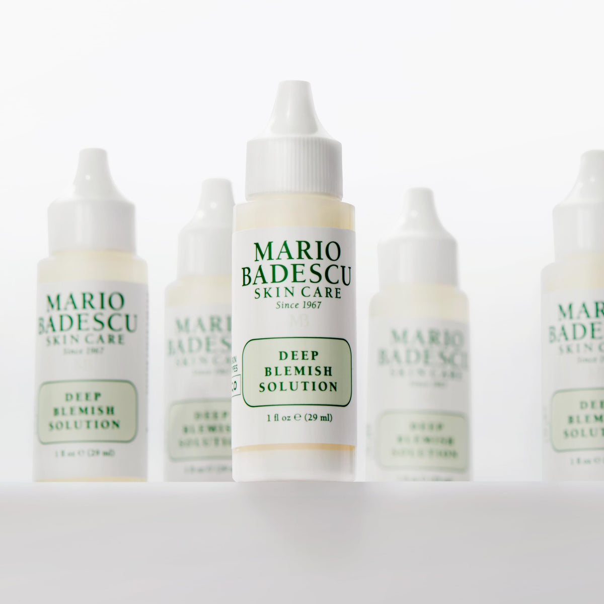 Mario Badescu fingertip applying spot treatment for precise targeting