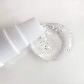 Mario Badescu next to a one-ounce measure for clear size and ounce reference benefit