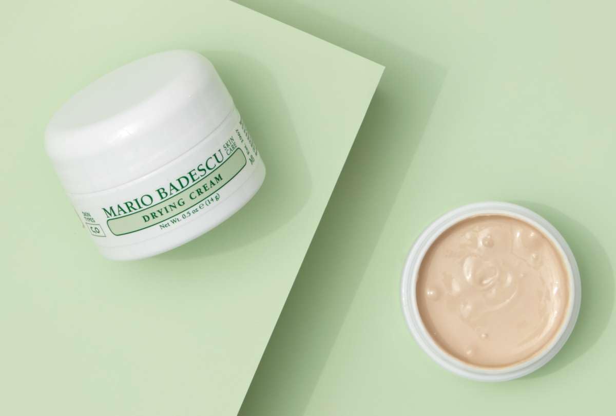 Mario Badescu drying cream on bathroom shelf styled with skincare for routine context