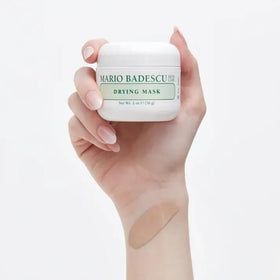 Mario Badescu tube held in hand showing size and travel-friendly convenience