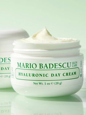 Mario Badescu jar next to a coin showing compact travel-friendly benefit