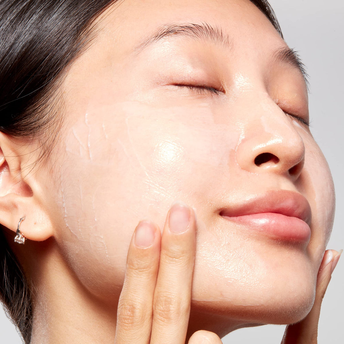 Mario Badescu mask staged with serum and towel illustrating layering in nighttime routine