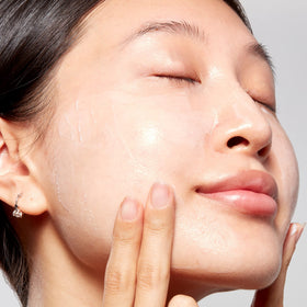 Mario Badescu mask staged with serum and towel illustrating layering in nighttime routine