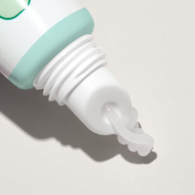 Mario Badescu applying mint lip balm on lips to soothe and soften dry skin