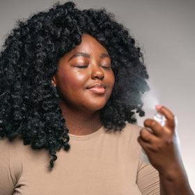 Mario Badescu mist spritz on model’s face delivering instant refreshing hydration