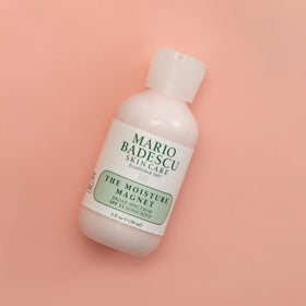 Mario Badescu applying product to hand to show lightweight absorption benefit