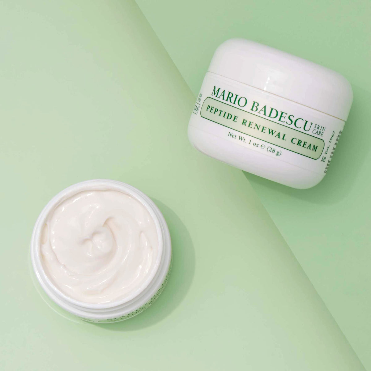 Mario Badescu one ounce jar next to coin, clarifies product size and scale