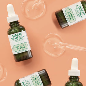 Mario Badescu product paired with sunscreen and towel promoting daytime sun protection