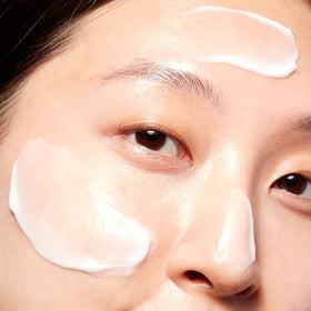 Mario Badescu jar on bedside table suggesting overnight skin recovery