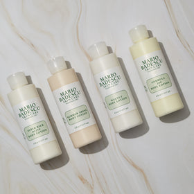 Mario Badescu pump dispensing lotion onto hand, demonstrating easy application and non-greasy finish