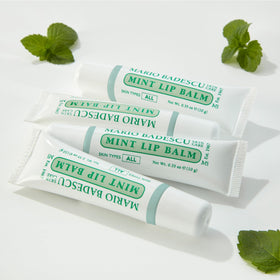 Mario Badescu Rose lip balm with cap off revealing soft tinted balm and gentle scent