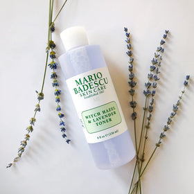 Mario Badescu 8 fl oz bottle in hand showing true size and travel suitability