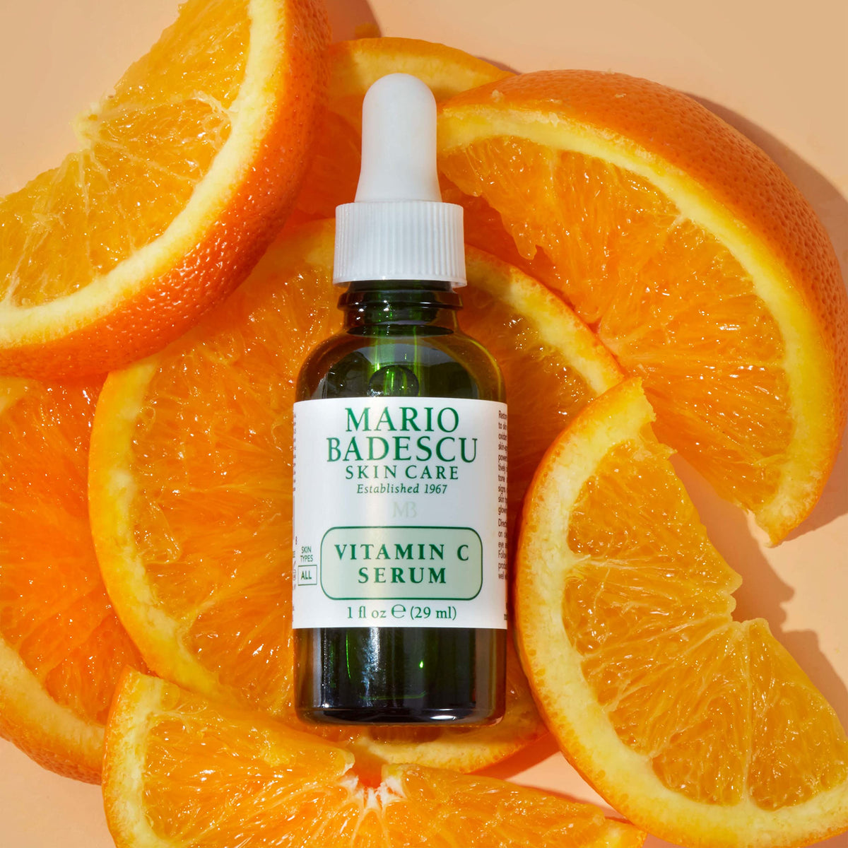 Mario Badescu applying serum to cheek demonstrating even coverage and quick layering