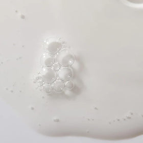 Mario Badescu serum staged in a night routine setting suggesting calming evening use