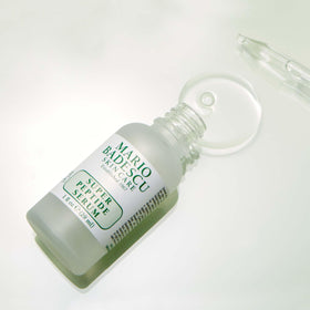 Mario Badescu serum on bathroom shelf in nighttime routine setting for routine-friendly benefit