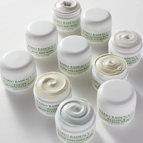 Mario Badescu jar next to fingertip for scale showing product size and usage details