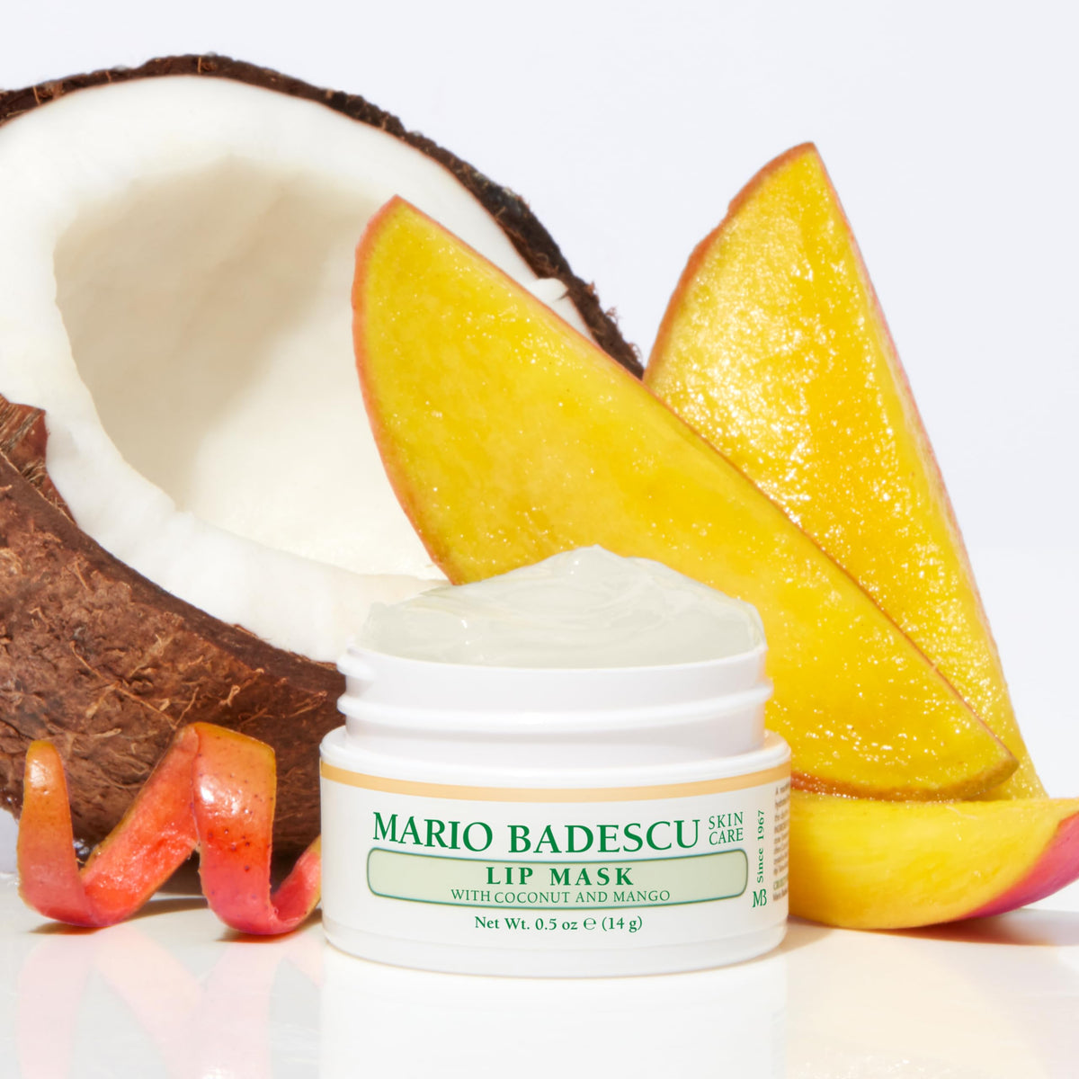 Mario Badescu jar next to coin showing compact 0.5 oz travel-friendly size