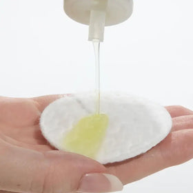 Mario Badescu toner applied with cotton pad demonstrating gentle oil removal