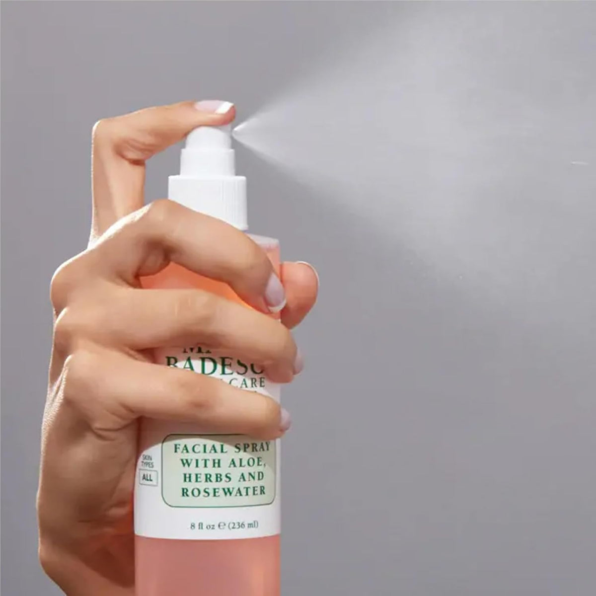 Mario Badescu spray in hand application illustrating convenient on-the-go use