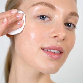 Mario Badescu pouring toner texture close-up demonstrating lightweight absorption