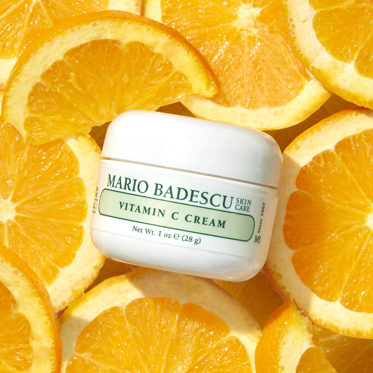 Mario Badescu cream next to 1 fl oz for size comparison and travel-friendly benefit