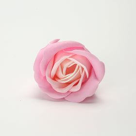 Marsrut hand holding single rose to show individual size and delicate decorative appeal